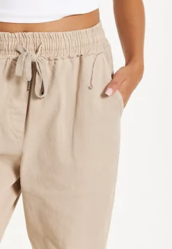 Beige Relaxed Fit Tapered Trousers