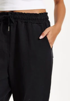 Black Relaxed Fit Tapered Trousers