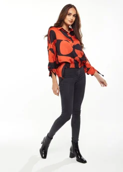 Liquorish Blouse with Oversized Polka Stripe Pattern in Red & Black