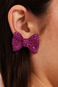 Liquorish Diamonte Bow Stud Earrings In Pink