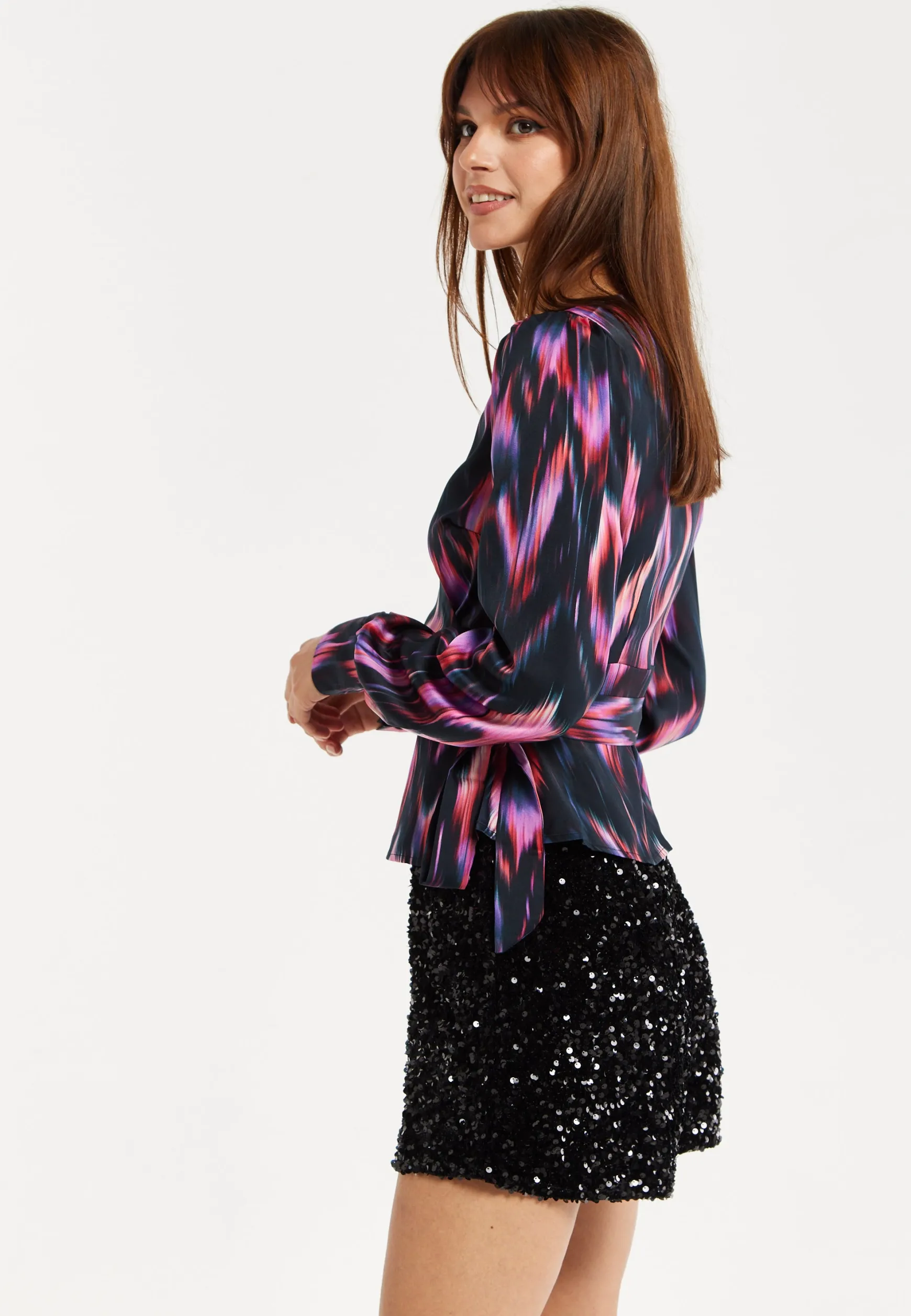 Women's Abstract Ikat Top in Black with Vibrant Feather Print, Long Balloon Sleeves, Button-Up High Neck Collar.