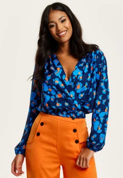 Women's Abstract Print Wrap Top In Pink, Orange, And Blue - Crossover Front, V Neck, Long Sleeves, Elasticated Waist