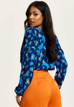 Women's Abstract Print Wrap Top In Pink, Orange, And Blue - Crossover Front, V Neck, Long Sleeves, Elasticated Waist