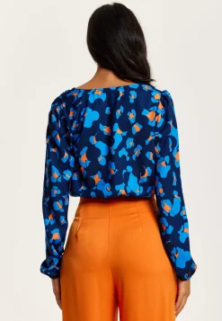 Women's Abstract Print Wrap Top In Pink, Orange, And Blue - Crossover Front, V Neck, Long Sleeves, Elasticated Waist