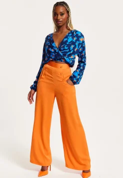 Women's Abstract Print Wrap Top In Pink, Orange, And Blue - Crossover Front, V Neck, Long Sleeves, Elasticated Waist