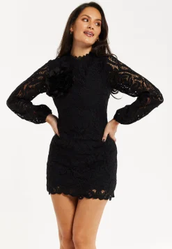 Women's Black Lace Mini Dress with Balloon Sleeves and Flower Detail - Elegant, Floral Embellishment, High Neckline.