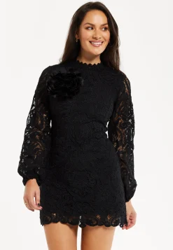 Women's Black Lace Mini Dress with Balloon Sleeves and Flower Detail - Elegant, Floral Embellishment, High Neckline.
