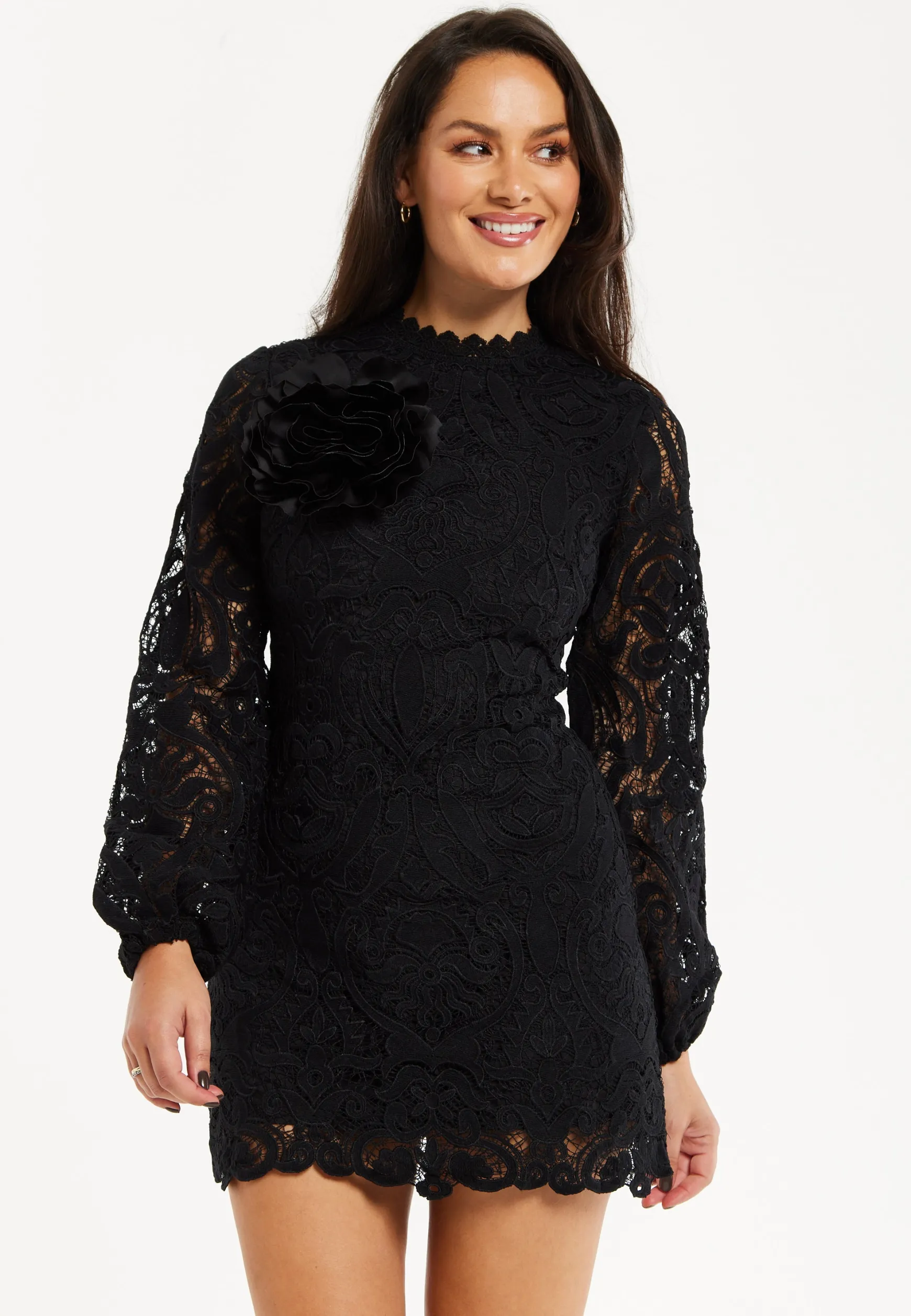 Women's Black Lace Mini Dress with Balloon Sleeves and Flower Detail - Elegant, Floral Embellishment, High Neckline.
