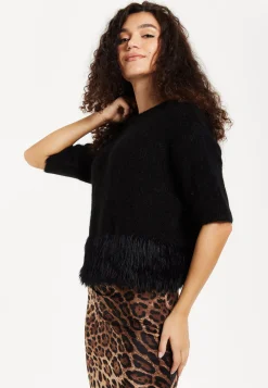 Women's Black Short Sleeves Jumper with Unique Hem Details for Comfortable Loose Fit