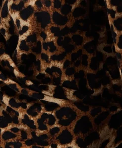 Women's Brushed Knit Animal Print Top - Long Sleeves, V-Neck Crossover, Regular Fit, Chic Wild Elegance.