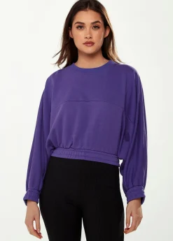 Women's Cropped Sweatshirt in Purple with Unique Bat and Balloon Sleeves, Round Neck, and Elastic Cuffs for a Chic Look