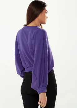 Women's Cropped Sweatshirt in Purple with Unique Bat and Balloon Sleeves, Round Neck, and Elastic Cuffs for a Chic Look