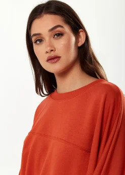 Women's Cropped Sweatshirt in Dark Orange with Voluminous Bat and Balloon Sleeves, Elastic Cuffs, and a Chic Design.