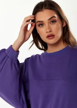 Women's Cropped Sweatshirt in Purple with Unique Bat and Balloon Sleeves, Round Neck, and Elastic Cuffs for a Chic Look