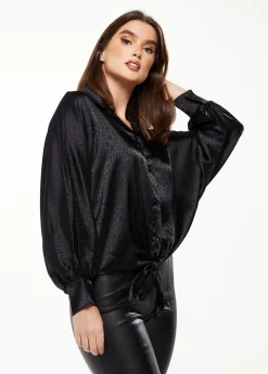 Women's Divine Grace Leopard Jacquard Blouse with Front Waist Tie in Black, Long Sleeves, Button Front, and Collar.