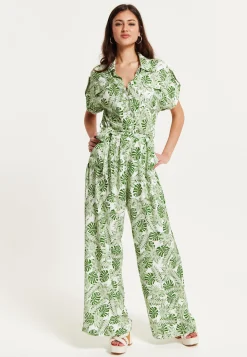 Women's Green Leaf Printed Loose Fit Jumpsuit with Tie Waist and Pocket Details - Liquorish