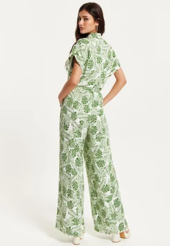 Women's Green Leaf Printed Loose Fit Jumpsuit with Tie Waist and Pocket Details - Liquorish