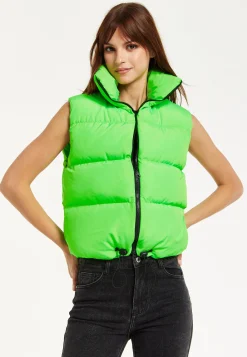 Women's Green Puffer Vest with Drawstring Hem - Cozy Zip-Up, High Collar, Adjustable Fit, Perfect for Layering.