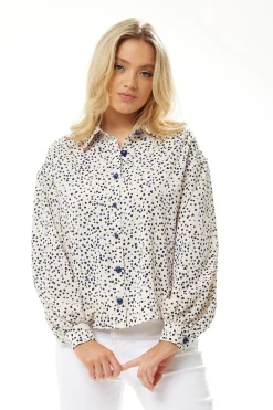 Women's Heart Print Shirt in Cream - Navy hearts, button-up front, heart-shaped buttons, collar, long sleeves, regular fit.