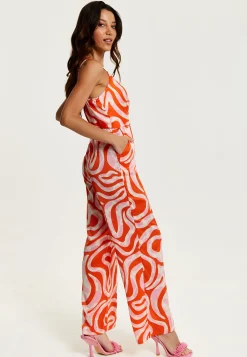 Women's Jumpsuit in Pink and Red Abstract Print with V Neck, Crossover Front, Tie Waist, Wide Legs - Liquorish