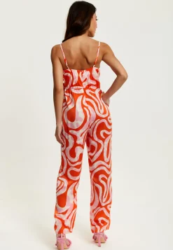 Women's Jumpsuit in Pink and Red Abstract Print with V Neck, Crossover Front, Tie Waist, Wide Legs - Liquorish