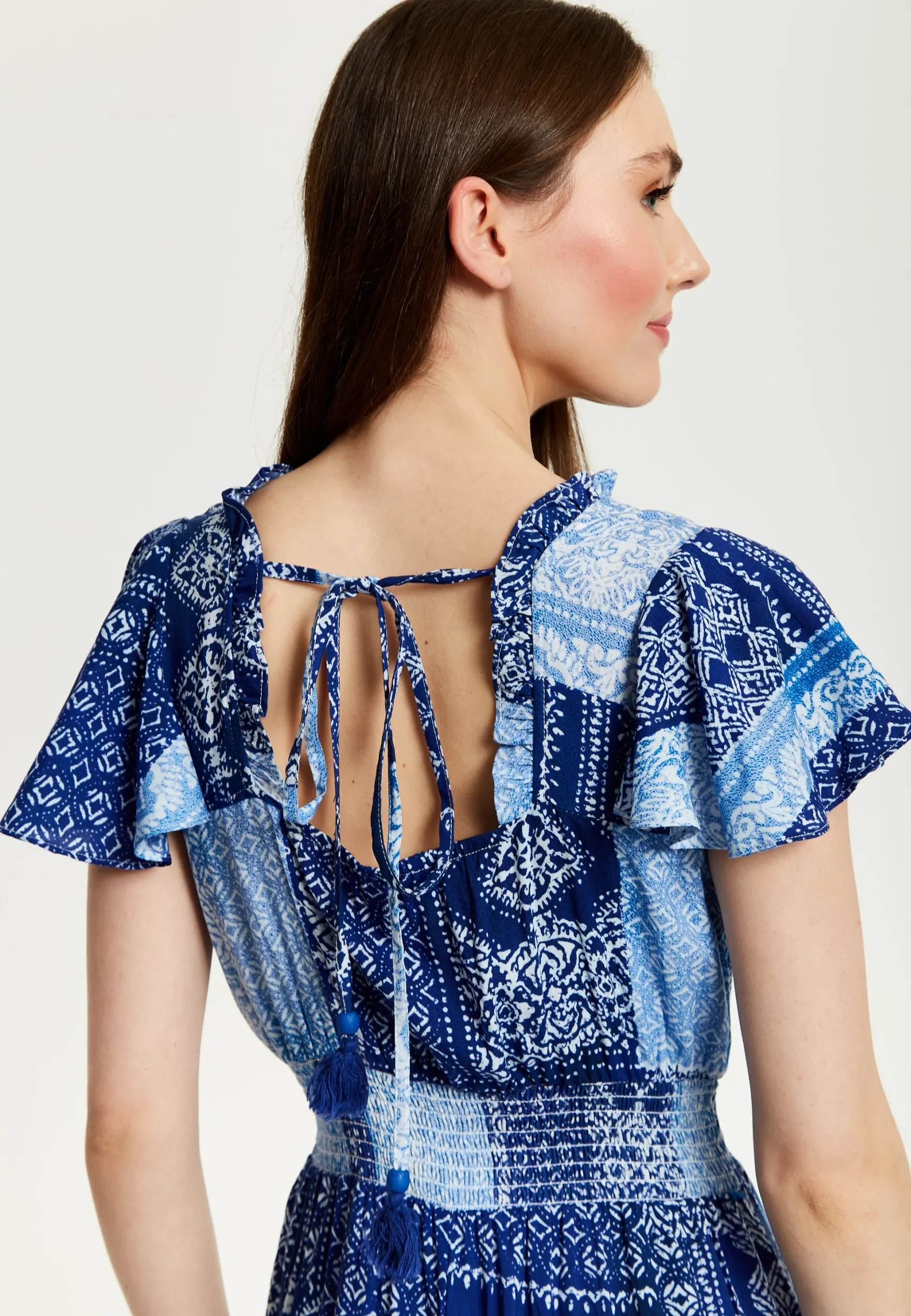 Women's Maxi Dress in Blue Tile Print with Short Sleeves and Open Back Tie Detail - Liquorish