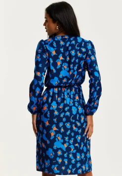 Women's Midi Wrap Dress in Blue with Long Sleeves - Elegant Abstract Print Design by Liquorish