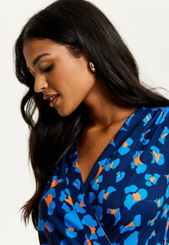 Women's Midi Wrap Dress in Blue with Long Sleeves - Elegant Abstract Print Design by Liquorish
