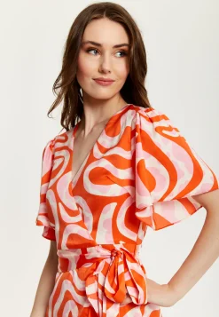 Women's Midi Wrap Dress in Pink and Red Abstract Print with Short Sleeves - Flattering V Neck and Tie Waist by Liquorish