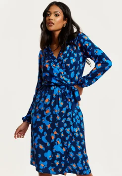 Women's Midi Wrap Dress in Blue with Long Sleeves - Elegant Abstract Print Design by Liquorish