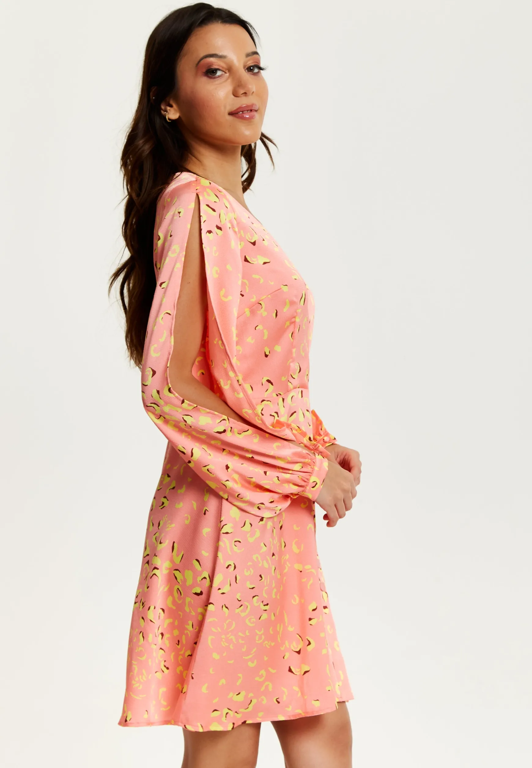 Women's Mini Dress in Peach with Slit Sleeves and Abstract Animal Print - Effortless Style by Liquorish