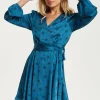 Women's Mini Dress in Petrol Blue with Long Sleeves, Black Star and Polka Dot Print Wrap Style by Liquorish