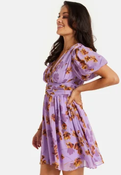 Women's Mini Dress in Purple Floral with Short Sleeves and Deep V Neck - Stylish Button Waistband by Liquorish