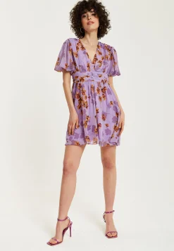 Women's Mini Dress in Purple Floral with Short Sleeves and Deep V Neck - Stylish Button Waistband by Liquorish