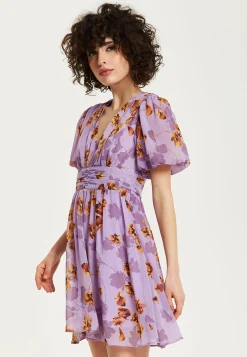 Women's Mini Dress in Purple Floral with Short Sleeves and Deep V Neck - Stylish Button Waistband by Liquorish