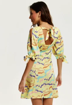 Women's Mini Dress in Yellow with Sleeve Tie-Ups and Back Tie-Up Detail - Abstract Zebra Print by Liquorish