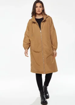 Women's Never Give up Parka in Camel with Eye-catching Embroidery, Oversized Hood, and Functional Design Features