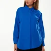 Women’s Shirt in Blue with Point Collar, Button Placket, Loose Fit, and Cuffs – Perfect for Any Occasion.
