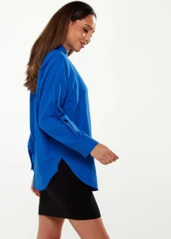 Women’s Shirt in Blue with Point Collar, Button Placket, Loose Fit, and Cuffs – Perfect for Any Occasion.
