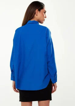 Women’s Shirt in Blue with Point Collar, Button Placket, Loose Fit, and Cuffs – Perfect for Any Occasion.