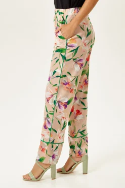 Women's Trousers in Floral Print with Green Piping and Side Pockets - Fitted Wide Leg Style by Liquorish