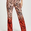 Women's Trousers in Orange and Nude Zebra Print with Slit Detail and Button Closure by Liquorish
