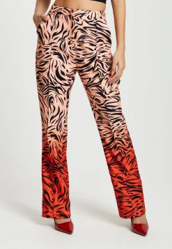 Women's Trousers in Orange and Nude Zebra Print with Slit Detail and Button Closure by Liquorish
