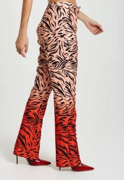 Women's Trousers in Orange and Nude Zebra Print with Slit Detail and Button Closure by Liquorish