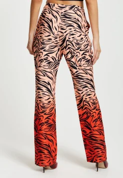 Women's Trousers in Orange and Nude Zebra Print with Slit Detail and Button Closure by Liquorish