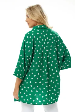 Women's White Heart Print Shirt in Green - Short sleeves, oversized fit, heart-shaped buttons, button-up front, collar.