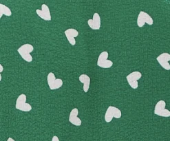 Women's White Heart Print Shirt in Green - Short sleeves, oversized fit, heart-shaped buttons, button-up front, collar.